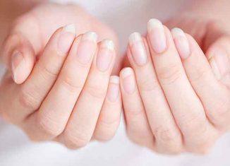 What are the possible causes of ridged nails?